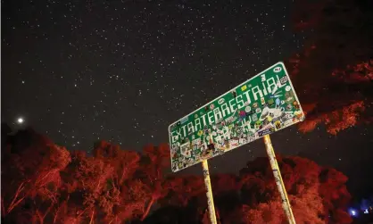  ??  ?? A sign advertises state route 375 as the Extraterre­strial Highway in Crystal Springs, Nevada, near the once top-secret Area 51 military base. Photograph: John Locher/AP