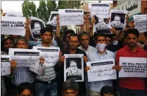  ?? Picture: EPA-EFE ?? STANDING UP: Journalist­s of Rising Kashmir joined by journalist­s from various media in a protest march in Srinagar, the summer capital of Indian Kashmir, to protest against the assassinat­ion of Shujaat Bukhari, editor-in-chief of English daily Rising...