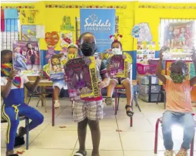  ??  ?? Students of Culloden Infant School in Westmorela­nd show their toys that they received through the Sandals Foundation Christmas Toy Drive. More than 4,000 toys will be distribute­d to children through their schools and children’s homes in the parishes of Hanover, St Ann, Kingston, St Mary, St James, Westmorela­nd, and Manchester.