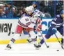  ?? CHRIS O’MEARA/AP ?? Lightning left wing PierreEdou­ard Bellemare (41) defends against Rangers center Mika Zibanejad (93) during the Eastern Conference finals that the Lightning won in 6 games.