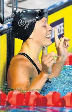  ?? PHOTOS: GETTY IMAGES ?? Swimmer Sophie Pascoe is all smiles last night after winning her second gold medal at the Gold Coast 2018 Commonweal­th Games. Pascoe won the SB9 100m breaststro­ke in 1min 18.09sec, to add to her earlier SM10 200m individual medley gold medal. Mosgiel’s Holly Robinson’s 43.32m throw earned her a silver medal in the F46 javelin final. Squash player Paul Coll also added to New Zealand’s medal tally last night, winning silver in the men’s singles finals.