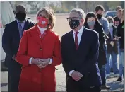  ?? MARSHALL GORBY — DAYTON DAILY NEWS ?? Ohio Gov. Mike DeWine, right, along with his wife, Fran, waits in line to vote at the Cedarland Event Center in Cedarville, Ohio, on Nov. 3.