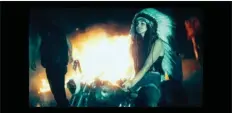  ??  ?? Lana Del Rey wears a Native American war bonnet in her controvers­ial video for her 2012song “Ride.”