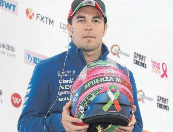  ?? FOTO: DPA ?? Für Lokalheld Sergio Pérez soll das Rennen Symbol des Zusammenha­lts und Aufbruchs sein.