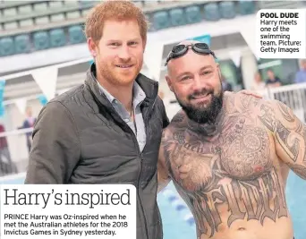  ??  ?? POOL DUDE Harry meets one of the swimming team. Picture: Getty Images