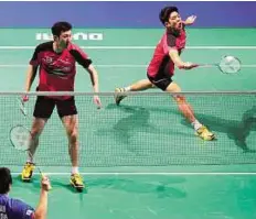  ?? AFP ?? Seeing double Lee Yong Dae (right) and Yoo Yeon Seong of Korea in action against Mohammad Ahsan and Hendra Setiawan of Indonesia.