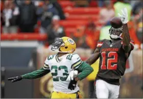  ?? RON SCHWANE—ASSOCIATED PRESS ?? Browns wide receiver Josh Gordon (12) reaches but can’t hold onto the ball against Packers cornerback Damarious Randall (23) on Dec. 10, 2017.