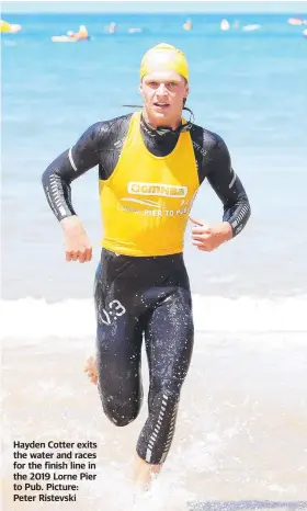  ?? Picture: Peter Ristevski ?? Hayden Cotter exits the water and races for the finish line in the 2019 Lorne Pier to Pub.