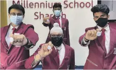  ?? Gems Millennium School Sharjah ?? From left, vaccinated pupils Siddharth Gusani, Trrishman Basoor, Abdul Mohsin and Adithya Suresh