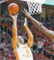  ?? AP PHOTO/ JOY KIMBROUGH ?? Tennessee forward Grant Williams scores against Florida on Saturday at Thompson-Boling Arena.