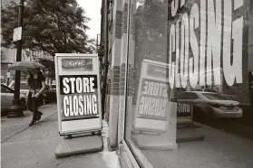  ?? Steven Senne / Associated Press ?? The U.S. economy plunged sharply into a recession earlier this year when the pandemic led many companies to lay off workers and temporaril­y close.