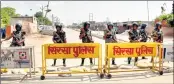  ??  ?? Security forces stand guard at the main entrance to the Dera Sacha Sauda headquarte­rs, in Sirsa district of Haryana on Friday, ahead of the search operations inside the premises. PTI