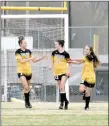  ?? MARK HUMPHREY ENTERPRISE-LEADER ?? Prairie Grove girls soccer players junior Trinity Dobbs (left), and freshman Reese Powell (right) congratula­te senior Alyssa LeDuc after a goal. The Lady Tigers entered April undefeated at 6-0.