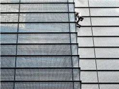  ?? AP ?? Frenchman Alain Robert makes his way up London’s Heron Tower, which is more than 200 metres high.