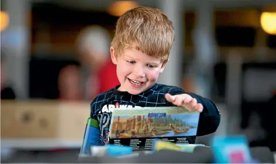 ?? PHOTO: CHRISTEL YARDLEY/FAIRFAX NZ ?? Flynn Archibald, 4, was hoping to find a Star Wars tale at the Red Cross book fair in Hamilton.