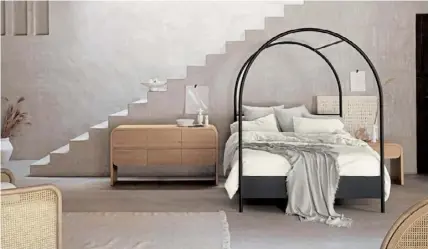  ??  ?? Metal arch queen canopy bed.