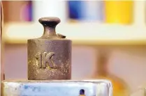  ?? DREAMSTIME/TNS ?? All kilograms, like the one above, were measured for the past 130 years by Le Grand K, a golf-ball sized hunk of 90% platinum and 10% iridium, kept in a locked vault in France.