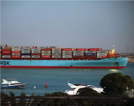  ?? Bloomberg ?? Maersk’s Sentosa container ship on the Suez Canal. The company suspended the use of the Bab Al Mandeb this month