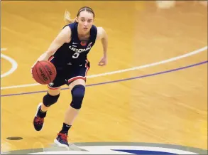  ?? Noah K. Murray / Associated Press ?? UConn guard Paige Bueckers (5) dribbles against Seton Hall on Tuesday in South Orange, N.J. UConn won 92-65.