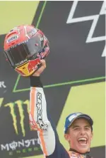  ?? — AFP ?? Marc Marquez celebrates on the podium after the Czech MotoGP event in Brno.