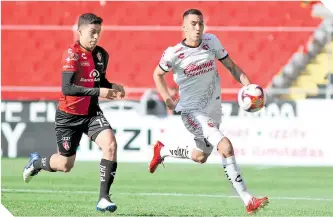  ?? FOTO: AFP ?? Tijuana no fue un flan en el estadio Jalisco y le complicó la vida a los atlistas. /