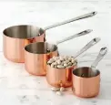  ??  ?? Copper measuring cups, $40 (set of 4); Williams-Sonoma