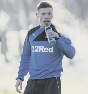  ??  ?? Greg Docherty takes a drink during his first training session with his new Rangers team-mates.