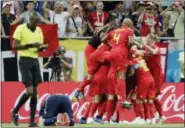  ?? PETR DAVID JOSEK — THE ASSOCIATED PRESS ?? Belgium’s team celebrates Nacer Chadli after he scored the decisive final goal during the round of 16 match between Belgium and Japan at the 2018 soccer World Cup in the Rostov Arena, in Rostov-on-Don, Russia, Monday.