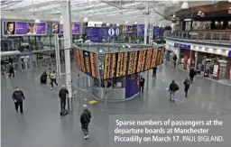  ?? PAUL BIGLAND. ?? Sparse numbers of passengers at the departure boards at Manchester Piccadilly on March 17.