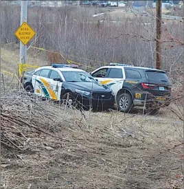  ?? CAPE BRETON POST PHOTO ?? The Cape Breton Regional Police Service is maintainin­g a presence where human remains were discovered Saturday in a wooded area near the former site of Sydney’s coke ovens.