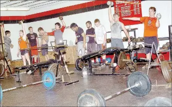  ?? SUBMITTED PHOTO ?? McDonald County High School athletes work out as a group during a recent summer weightlift­ing session.