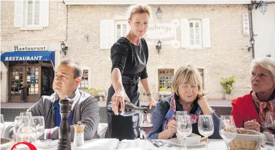  ?? PHOTOS: ED ALCOCK/ THE NEW YORK TIMES ?? Top: Isabelle Crotet Billard pours a glass of wine at her second restaurant, Auberge Bourguigno­nne, in Beaune, France.