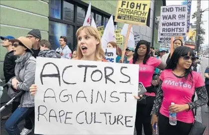  ?? Mark Ralston AFP/Getty Images ?? VICTIMS of sexual harassment, sexual abuse and their supporters take part in a #MeToo march in Hollywood on Sunday.