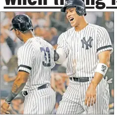  ??  ?? JUMP FOR JOY: Aaron Judge (right) celebrates with Aaron Hicks after they scored on Edwin Encarnacio­n’s (left) three-run double during the fifth inning of the Yankees’ 4-0 win over Toronto.