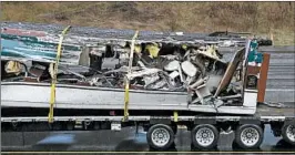  ?? ELAINE THOMPSON/AP ?? Train wreckage is removed Tuesday from the site of Monday’s fatal crash in DuPont, Wash.
