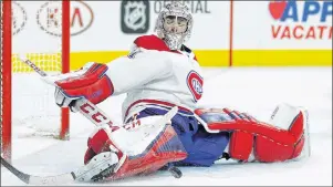  ?? AP PHOTO ?? Montreal Canadiens’ Carey Price stops a shot by Philadelph­ia Flyers’ Claude Giroux, not pictured, in the second period of an NHL game Tuesday night in Philadelph­ia.
