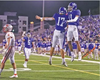  ?? STAFF PHOTO BY MATT HAMILTON ?? McCallie’s John David Tessman (17) and Eric Rivers leap in celebratio­n after the Blue Tornado scored a touchdown against Baylor on Oct. 2 at Finley Stadium. McCallie is trying to repeat as TSSAA Division II-AAA state champion and win the program’s third title overall.