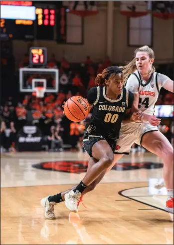  ?? UNIVERSITY OF COLORADO ATHLETICS ?? Colorado’s Jaylyn Sherrod, left, drives around Oregon State’s Adlee Blacklock during a women’s basketball game at Gill Coliseum in Corvallis, Ore., on Sunday.