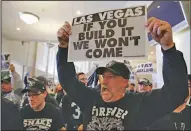  ?? Associated Press ?? Fans speak: Oakland Raiders fans hold up signs and yell during a rally to keep the team from moving Saturday in Oakland, Calif. NFL owners are expected to vote on the team's possible relocation to Las Vegas on Monday or Tuesday at their meeting in...