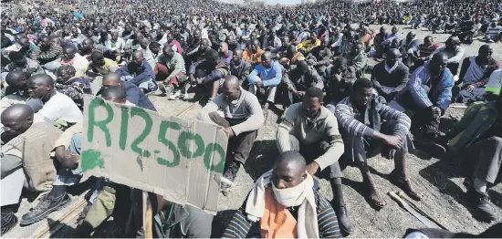  ?? Pictures: Gallo Images ?? LIVING WAGE. Striking mine workers make their demands known at Nkageng informal settlement five years ago.