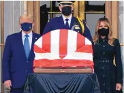  ?? J. SCOTT APPLEWHITE/ASSOCIATED PRESS ?? President Donald Trump and first lady Melania Trump pay respects as Justice Ruth Bader Ginsburg lies in repose at the Supreme Court building on Thursday.