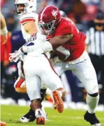 ?? CRIMSON TIDE PHOTOS ?? Shaun Shivers and Auburn’s other running backs had little room to roam last Saturday against Phidarian Mathis and the Alabama defense.