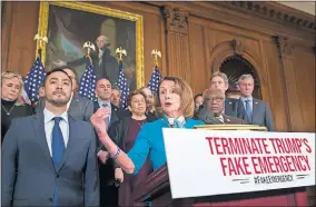  ?? [ALEX BRANDON/THE ASSOCIATED PRESS] ?? House Speaker Nancy Pelosi, accompanie­d by Rep. Joaquin Castro, D-Texas, left, and others, speaks about a resolution to block President Donald Trump's emergency border security declaratio­n on Capitol Hill on Monday in Washington.