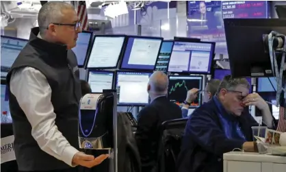  ??  ?? The floor of the New York stock exchange as Trump’s travel ban ushered in another big fall for stock markets. Photograph: Richard Drew/ AP