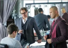  ?? DAVID M. RUSSELL — CBS VIA AP ?? Michael Weatherly as Dr. Jason Bull, background left, and Chris Jackson as Chunk Palmer, right, in a scene from, “Bull,” premiering on Sept. 20.