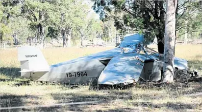  ?? PHOTO: JEREMY SOLLARS / WARWICK DAILY NEWS ?? VERY LUCKY: Two Caboolture men suffered back injuries after their home-built plane crashed at Leyburn.