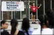  ?? ERIN O. SMITH — MEMBER IMAGE SHARE, CHATTANOOG­A TIMES FREE PRESS ?? In this Aug. 11, 2019, file photo, Seo Yoon “Yoonie” Yang, with Students Demand Action, speaks during a vigil to remember the victims of the El Paso, Texas, and Dayton, Ohio, mass shootings and call for lawmakers to take action against gun violence at Miller Park in Chattanoog­a, Tenn.