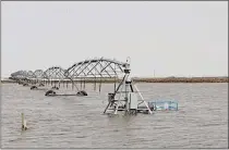  ?? SUBMITTED PHOTO KIM MACDONALD CAMERON ?? Flooding surrounds the irrigation pivots south of Burdett after a weekend of rain and melting snow in the County of Forty Mile.