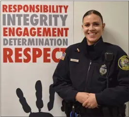  ?? COURTESY LOWELL POLICE DEPARTMENT ?? Lowell Police School Resource Officer Erica Torres stands inside Lowell High School.