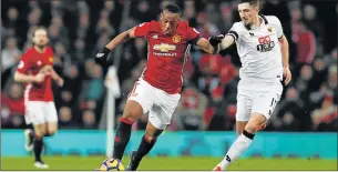  ?? Picture: REUTERS ?? NEAR UNSTOPPABL­E: Manchester United’s Anthony Martial dribbles past Watford’s Craig Cathcart. The rising star hopes to shine against Saint-Etienne